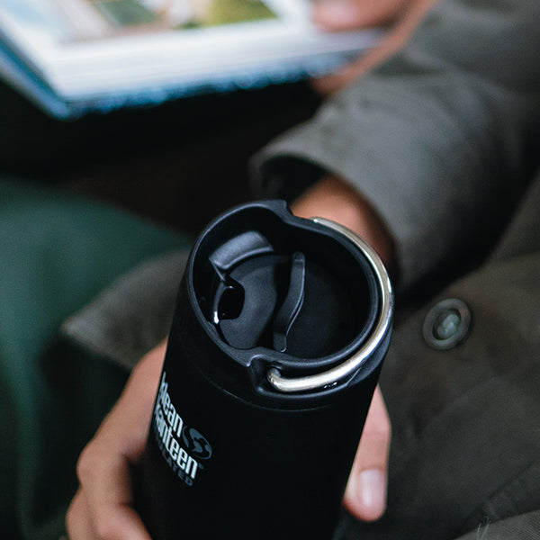 Man holding Klean Kanteen TKWide insulated bottle with cafe cap
