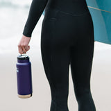 Woman in wet suit holding bottle by Klean Kanteen TKWide Loop Cap